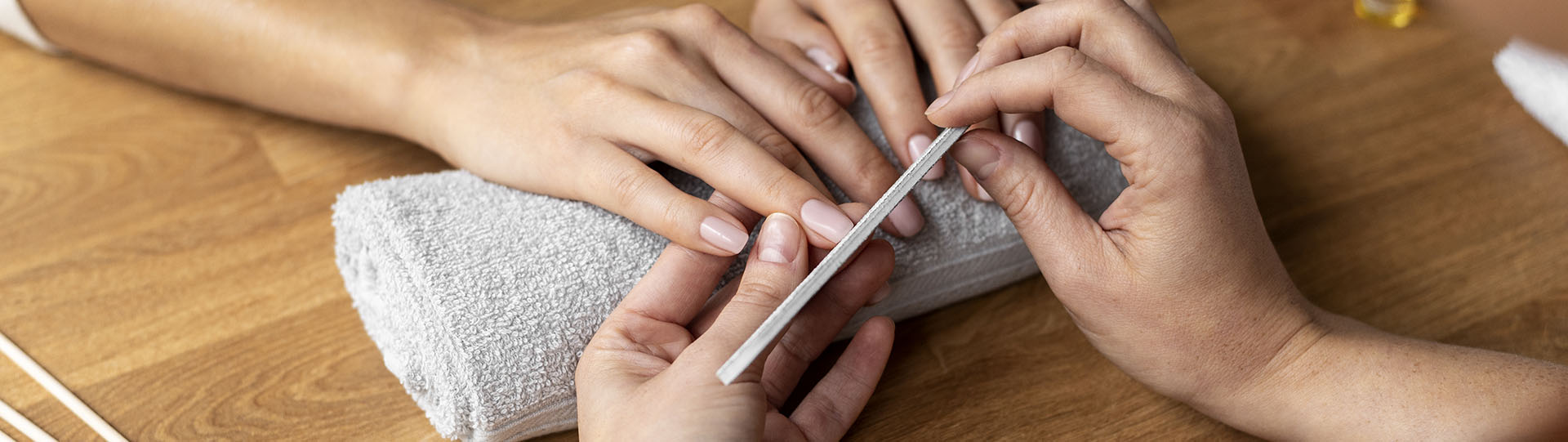 hands holding nail file close up 1