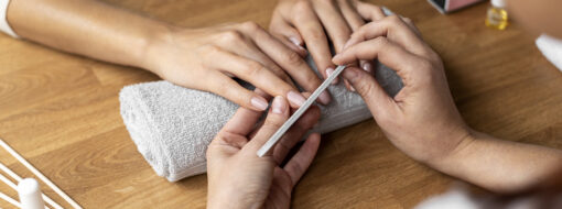 hands holding nail file close up